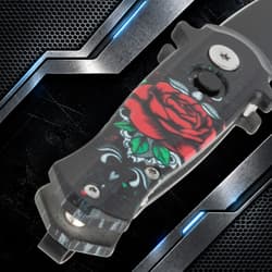 Close-up of knife handle with rose design