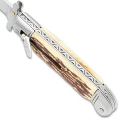 The automatic stiletto knife's fileworked handle spine shown