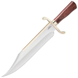 Large bowie knife with decorative curvatures and gold accents along with a wood handle.