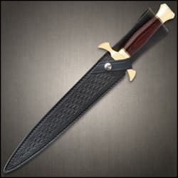 Dagger sheathed in a black leather belt sheath