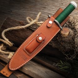 Rambo First Blood Licensed Rambo Knife Brown Leather Sheath with white stitching and a snap closure strap for secure holding external pouch. Sheath embossed with "Rambo First Blood" logo