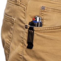 Khaki pants pocket holding closed black pocket knife caddy with blue lighter with black pocket clip securing the caddy to the pocket.