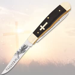 Open pocket knife with cross handle and 'Salvation' etched blade