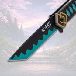 Close-up of knife blade with teal wave pattern