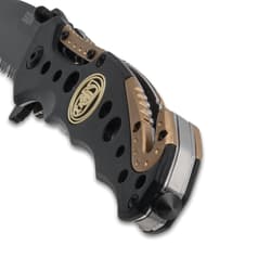 Close-up of knife handle with skull logo
