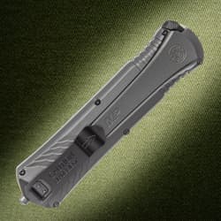 Back view of closed Smith & Wesson knife on textured background