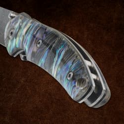 Close-up of abalone handle on a pocket knife