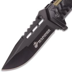 Close-up of black knife blade with Marines logo
