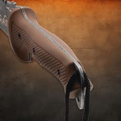 Close-up of machete's textured brown handle