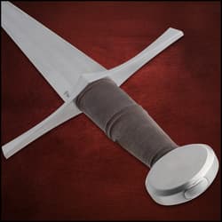 Close-up of sword hilt with brown grip and crossguard