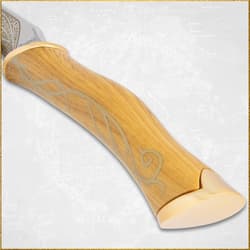 Close-up of a knife handle with engraved design