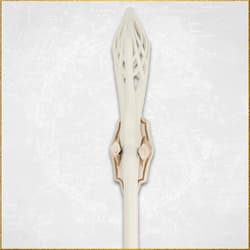Detailed view of the ornate top of a white staff