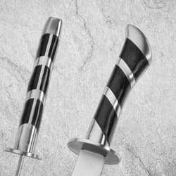 Close-up of scimitar's black and silver handle