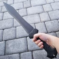 A hand holding the tpr rubberized handle of United Cutlery Combat Commander gladiator 1060 stainless steel sword with a sharp point