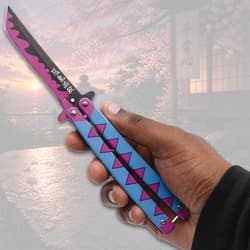 Hand holding a colorful butterfly knife