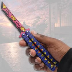 Hand holding a colorful butterfly knife, cherry blossom scene