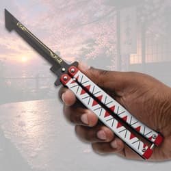 Hand holding butterfly knife with decorative handle