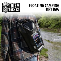 Person carrying a Totem Pack Co floating camping dry bag