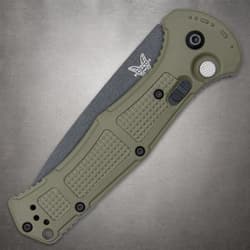 Closed olive drab knife with textured handle and logo