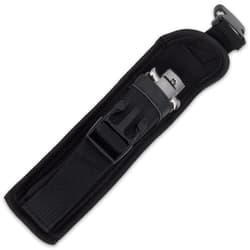 Closed switchblade enclosed in black nylon belt sheath with open buckle closure.