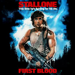 A movie poster for “First Blood” man holding an assault rifle with a bandolier of bullets across his chest.