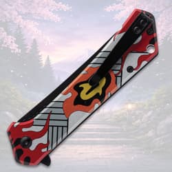 Folded knife with flame design and pocket clip, scenic background