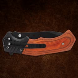 Closed folding knife with wooden handle and clip