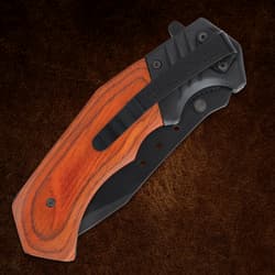 Closed folding knife with wooden handle and clip