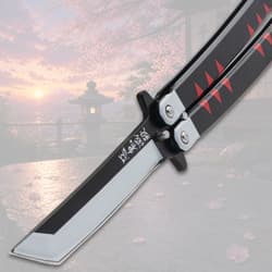 Close-up of butterfly knife blade with black handle, cherry blossom background