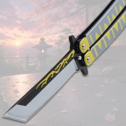 Close-up of butterfly knife blade with decorative design