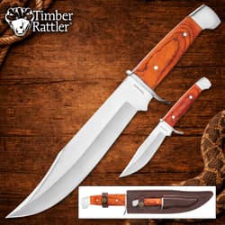 Two knives with wooden handles on a wooden background