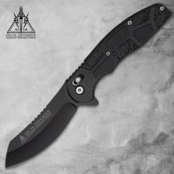 Black folding knife with textured handle on gray background
