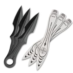 Set of black and white throwing knives on white background