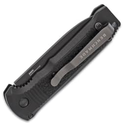 Closed black folding knife with a clip on the handle