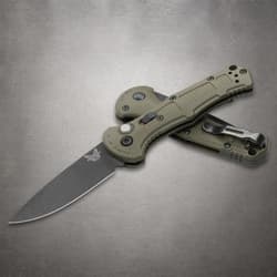 Two olive green folding knives, one open, one closed