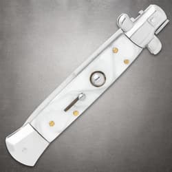 Closed white stiletto knife with pearl handle on gray background