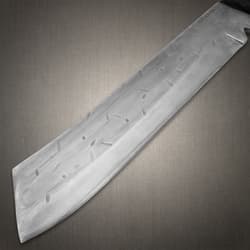 Close-up of machete blade with engraved details