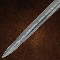 Close-up of Damascus sword blade on brown background