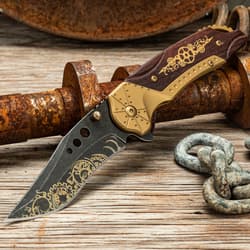 Steampunk knife with intricate design on rustic wooden surface