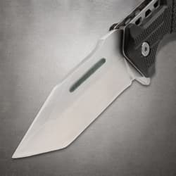 Close-up of a knife blade with a textured handle