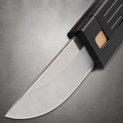 Close-up of a silver knife blade partially extended from a black handle
