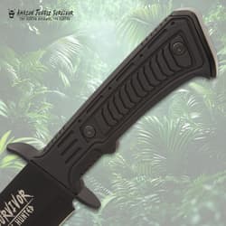 Close-up of knife handle with jungle background