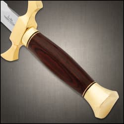 Close-up of dagger's wooden handle and gold pommel