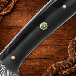 Detailed view of knife handle with decorative pin