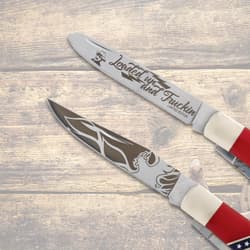 Close-up of knife blades with engraved designs