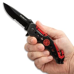 Hand holding Ridge Runner pocket knife with red accents