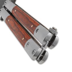 Close-up of the closed butterfly knife's handle and latch