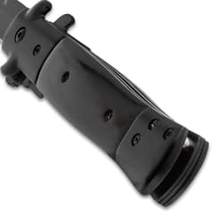 Close-up of the black stiletto knife handle with screws