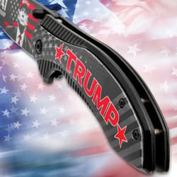 Close-up of knife handle with Trump text and star design