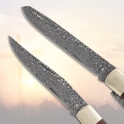 Close-up of two patterned knife blades